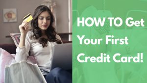 Young Woman Holding Credit Card In Front Of Laptop